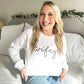 young woman modeling a wifey embroidered sweatshirt