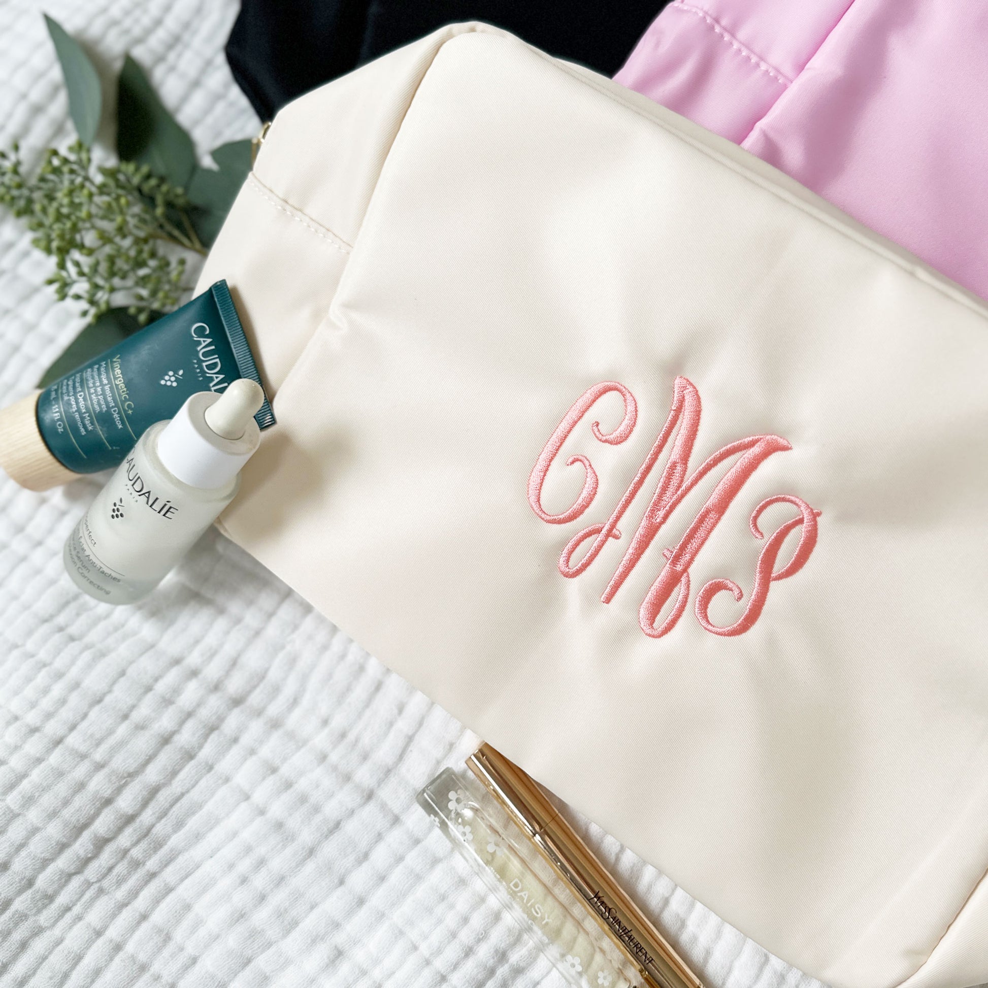 black, pink, and creme makeup bag with custom embroidery