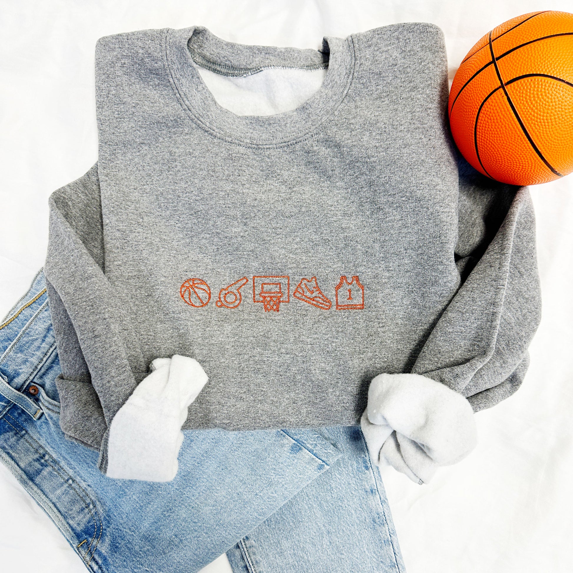 Graphite heather crewneck sweatshirt with basketball icons embroidered in orange thread