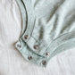 image of a three snap closure on a baby bubble romper