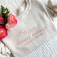 up close of embroidered crewneck sweatshirt with a tulip design above flower market locally grown text