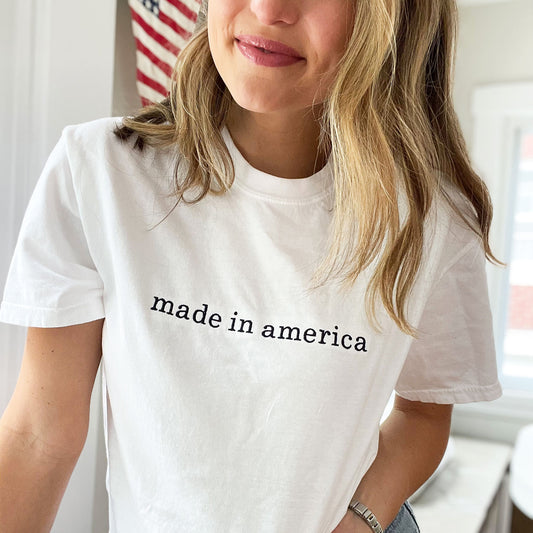 woman wearing white t-shirt with made in america embroidered across the chest