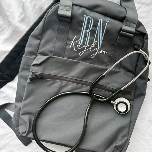 grey backpack embroidered nurse credentials and name