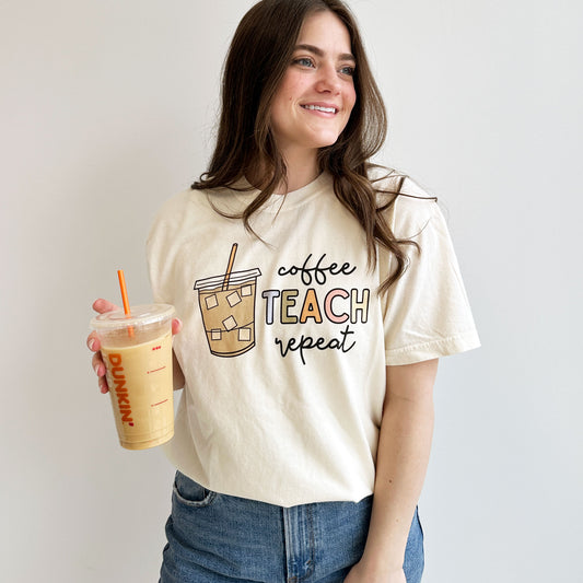 teacher wearing a cute coffee teach repeat comfort colors t-shirt