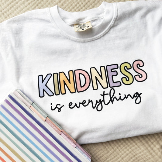 white t-shirt with a kindness is everything colorful printed design