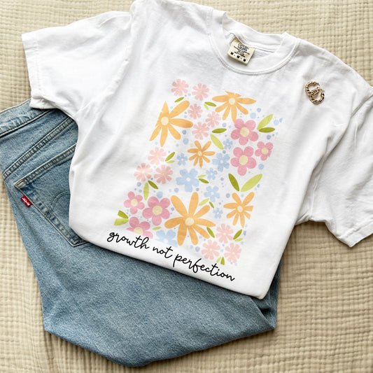 comfort colors t-shirt with a large multi-floral growth not perfection print