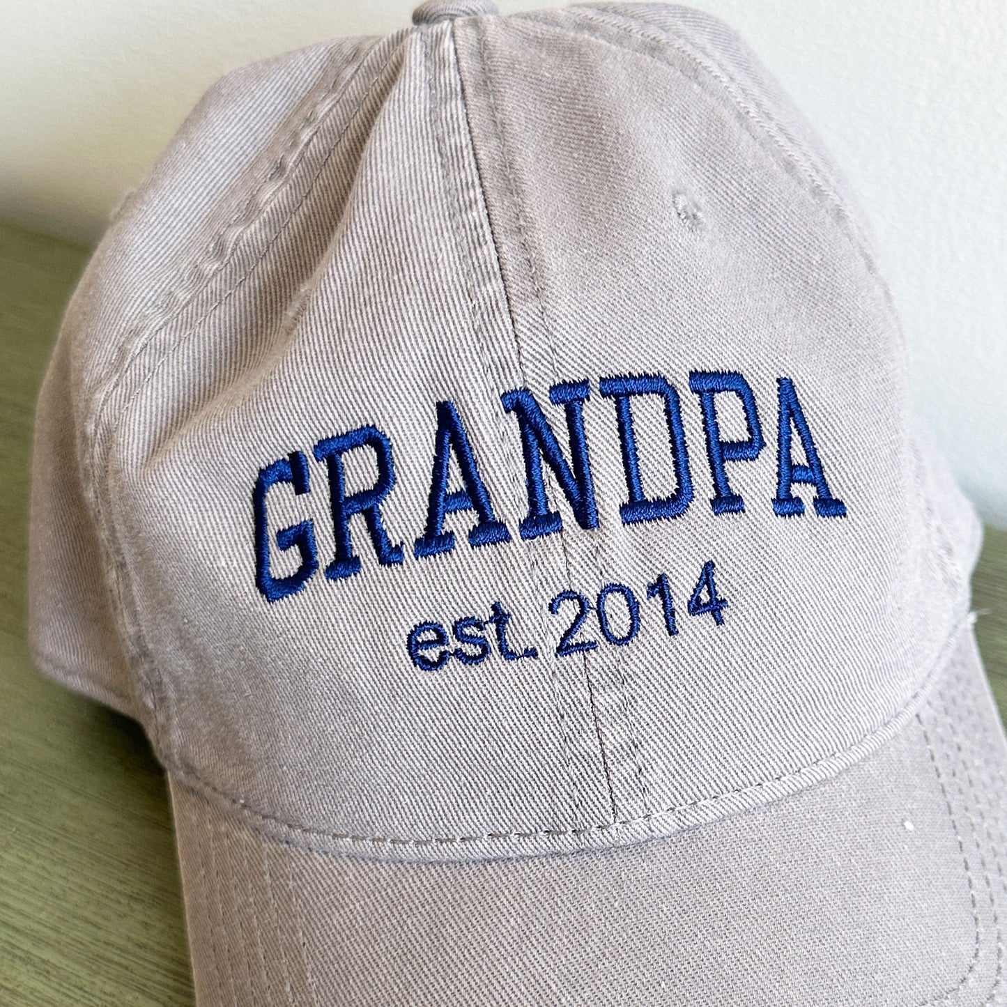 baseball hat with custom athletic font embroidery and custom date