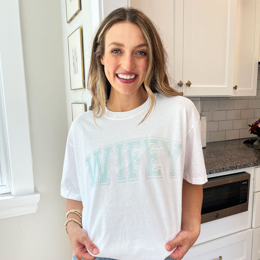 woman wearing a cute custom wifey printed oversized comfort colors t-shirt