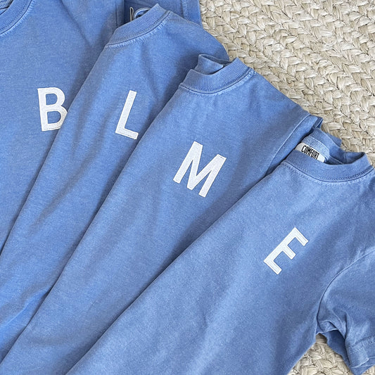 washed denim youth tshirt with initials embroidered in a block font on the left chest