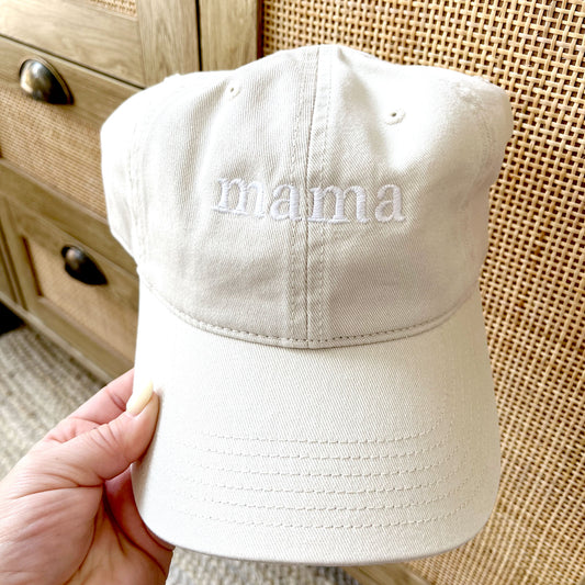 sand hat with embroidered mama design in a small lowercase font with a white thread