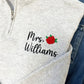 close up of custom name and mini rose embroidered design