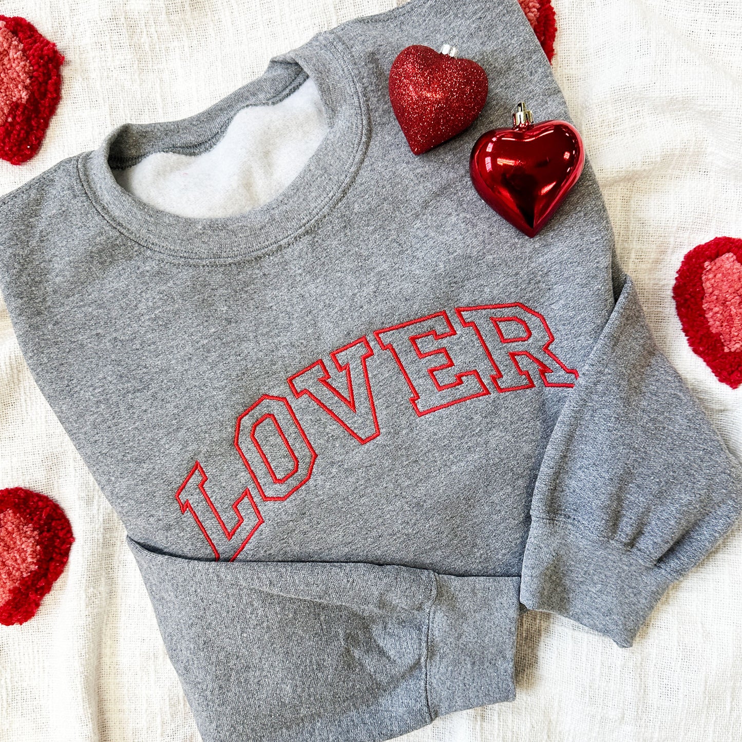 graphite heather crewneck sweatshirt with LOVER embroidered in an athletic block font across the chest