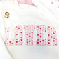 white crewneck sweatshirt with LOVER printed in a watercolor heart print across the chest