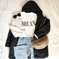 Styled flat lay of a Milan print crewneck sweatshirt