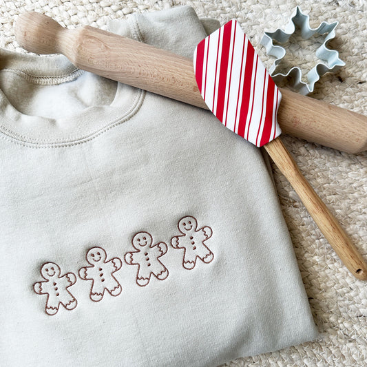 sand crewneck sweatshirt with a gingerbread man chestnut thread embroidery design