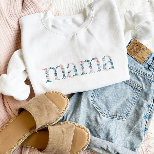 outfit featuring a white crewneck sweatshirt with custom floral mama embroidered design