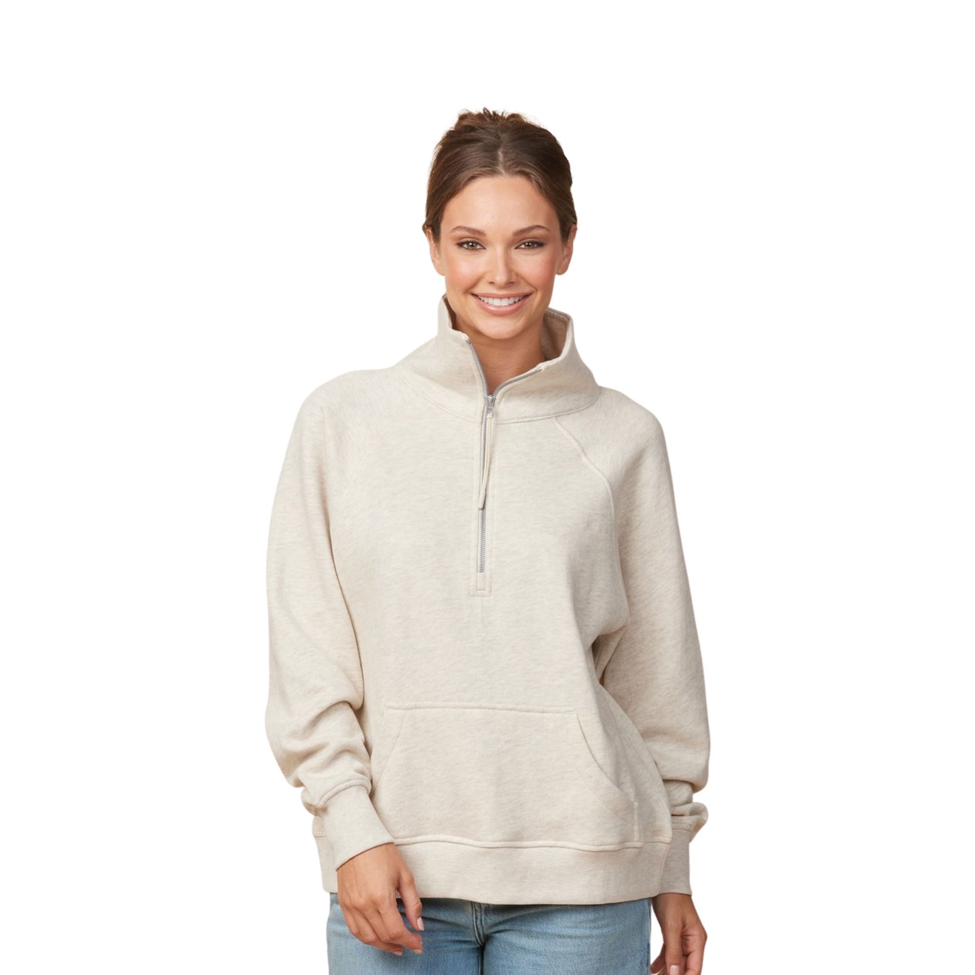 Woman wearing a beige half-zip sweatshirt on a white background