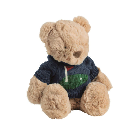 Teddy bear wearing a blue sweater with a golf design on a white background