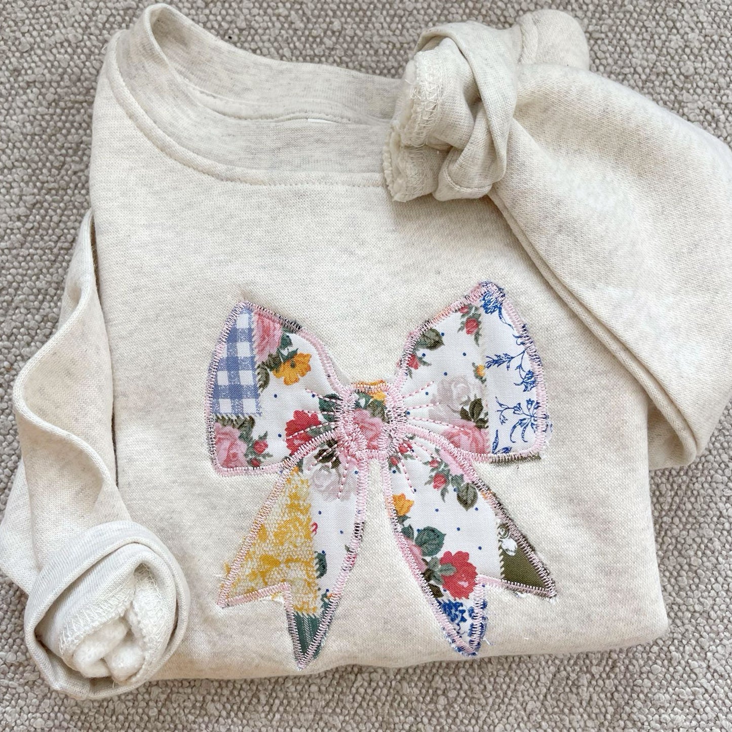 oatmeal heather crewneck with custom embroidered patchwork quilted bow embroidered design