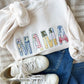 sweet cream crewneck sweatshirt with custom mama embroidered design featuring a vintage inspired patchwork quilted pattern with a raw edge for a homemade touch