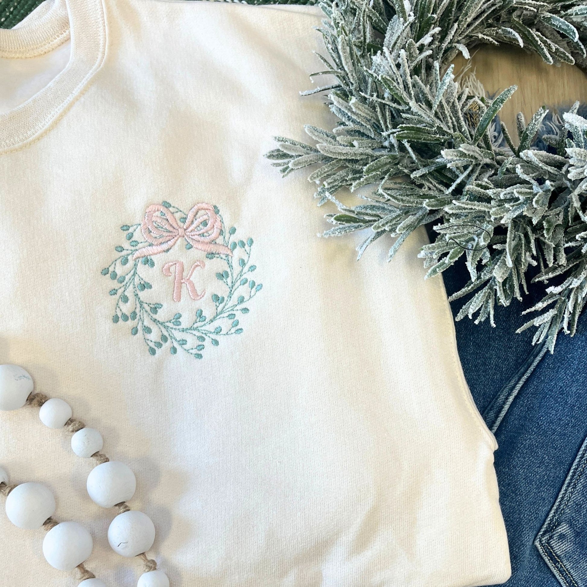 sweet cream crew with embroidered bow wreath and initial on the left chest