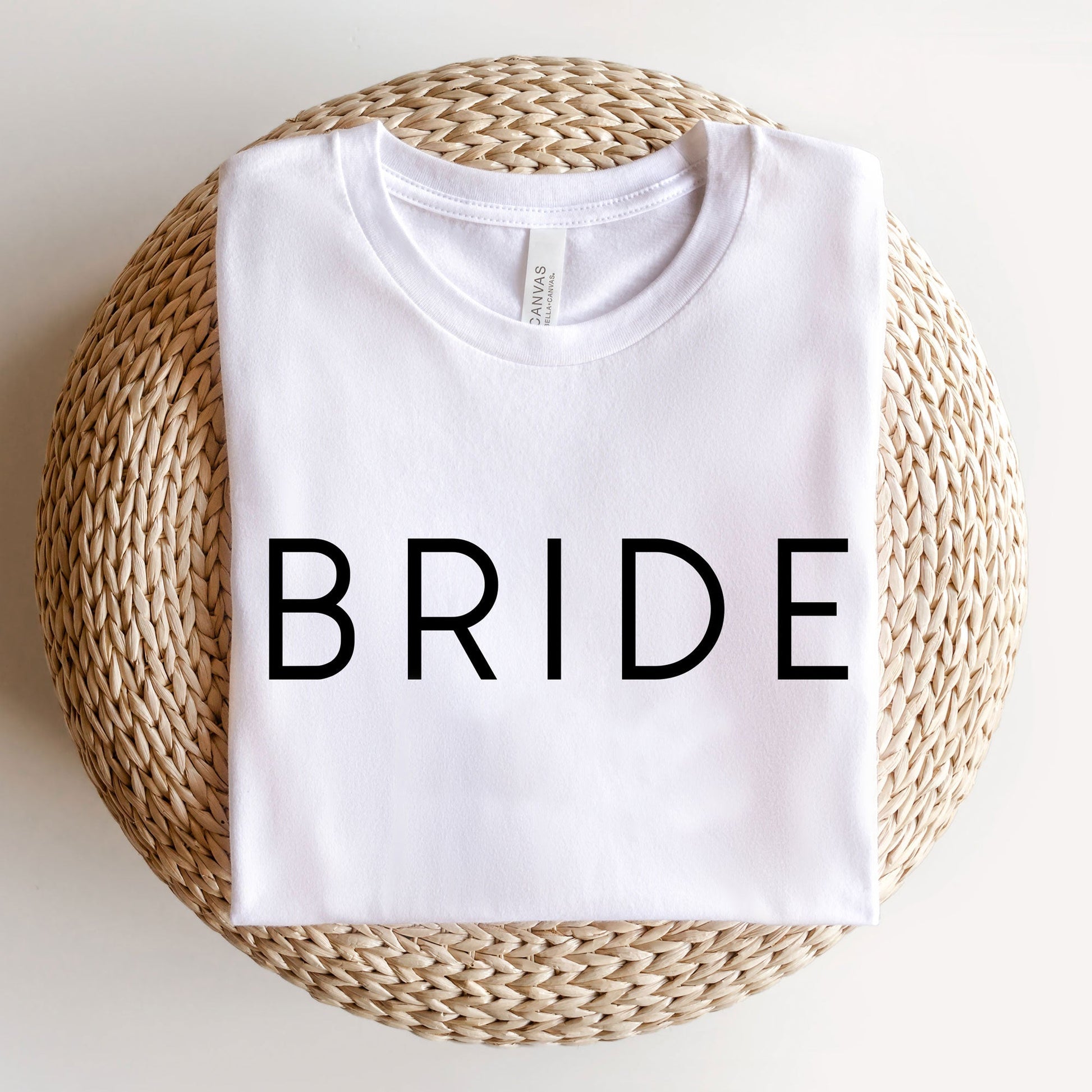 white bella and canvas t-shirt with a simple modern BRIDE print