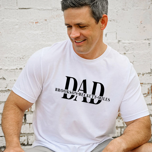 man wearing a custom dtg printed t-shirt with a large DAD split design with the names of his kids in the middle