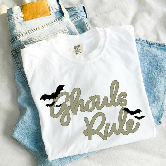 flat lay image of a comfort colors t-shirt with a ghouls rule print in a script font with bats