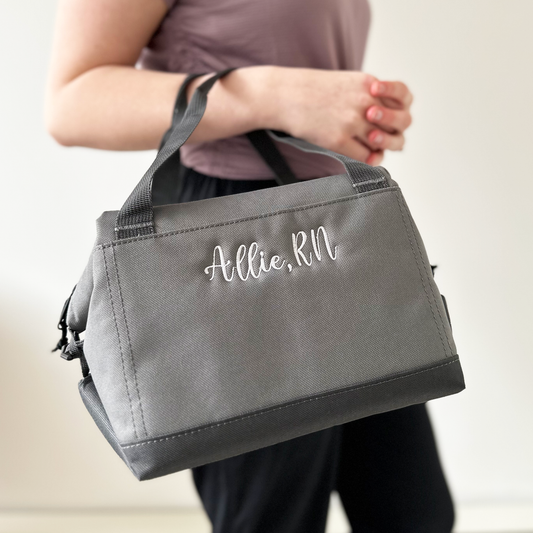 woman holding small personalized lunch bag