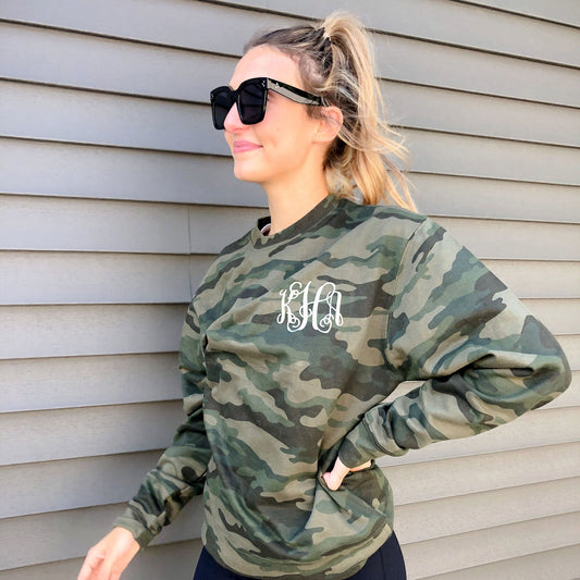 woman wearing casual camo crewneck pullover with custom three letter embroidered monogram
