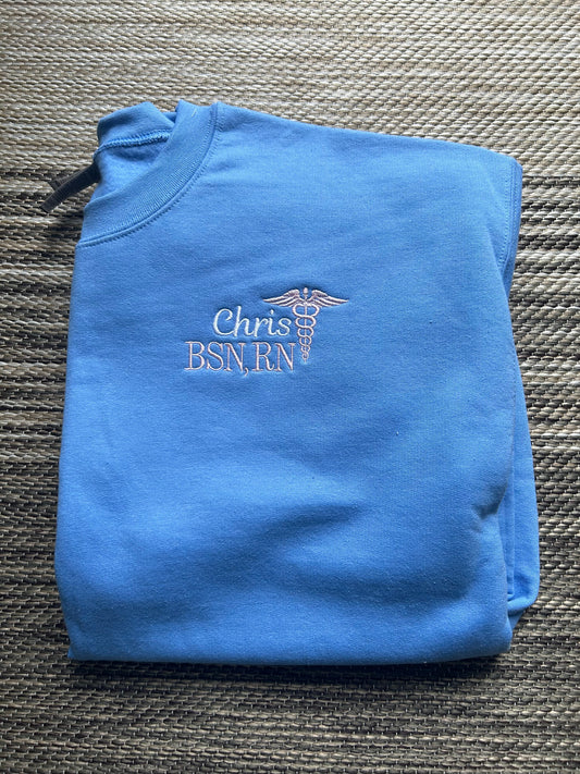 Carolina Blue Personalized Nurse Pullover Sweatshirt | Size Large | Chris, BSN, RN | Blooper