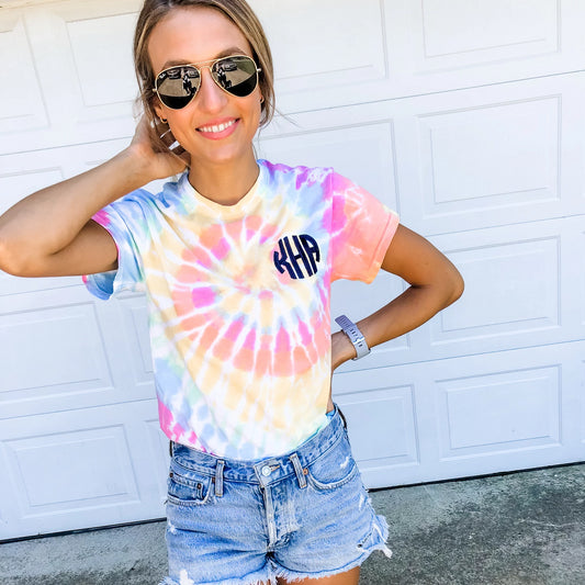 woman wearing a pastel tie dye t-shirt with personalized monogrammed embroidery
