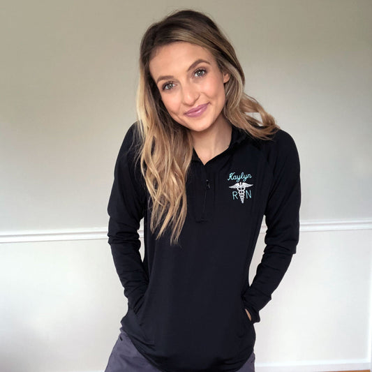 woman in scrubs wearing embroidered athletic jacket 
