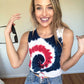 woman wearing a red white and blue spiral dye tank top