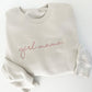 heather dust bella and canvas crewneck sweatshirt with girl mama embroidered in a pink thread across the chest