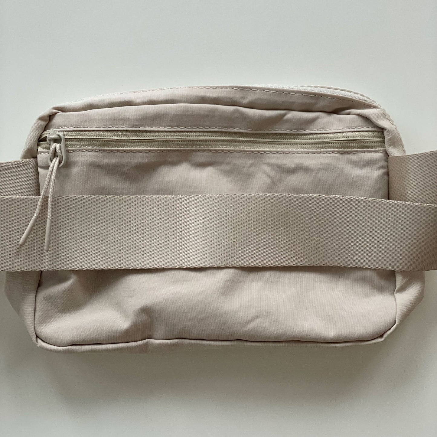 back of fanny pack nylon crossbody, showing zipper pocket