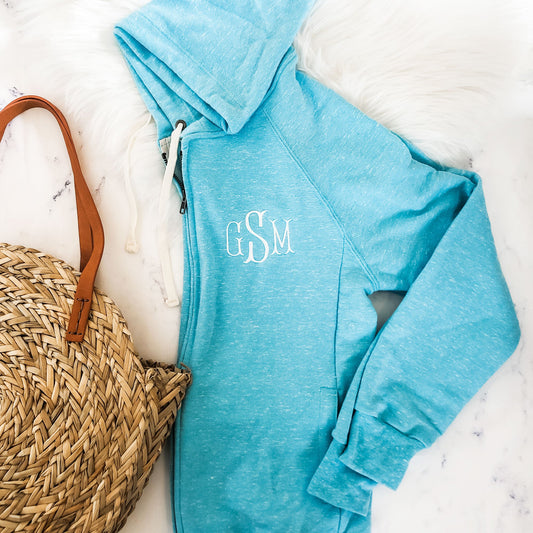 caribbean blue full zip hooded jacket with embroidered three letter monogram on left chest 