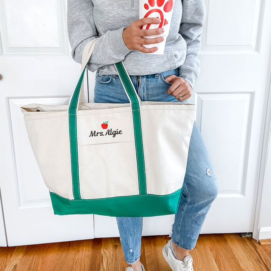 woman holding emerald green tote as well as chickfila cup