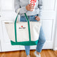 woman holding emerald green tote as well as chickfila cup