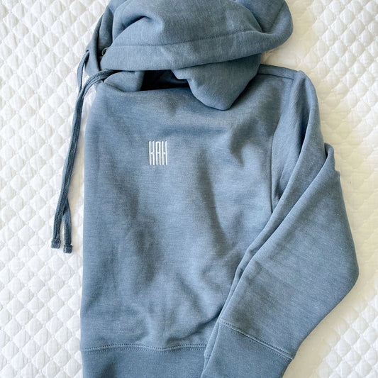 flat lay of mini initial embroidered hoodie