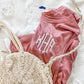 close up of three letter monogram embroidered on a pink bella ad canvas tank top