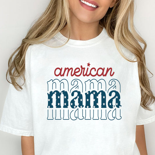 woman wearing a white t-shirt featuring a patriotic 'american mama' print in red white and blue ink