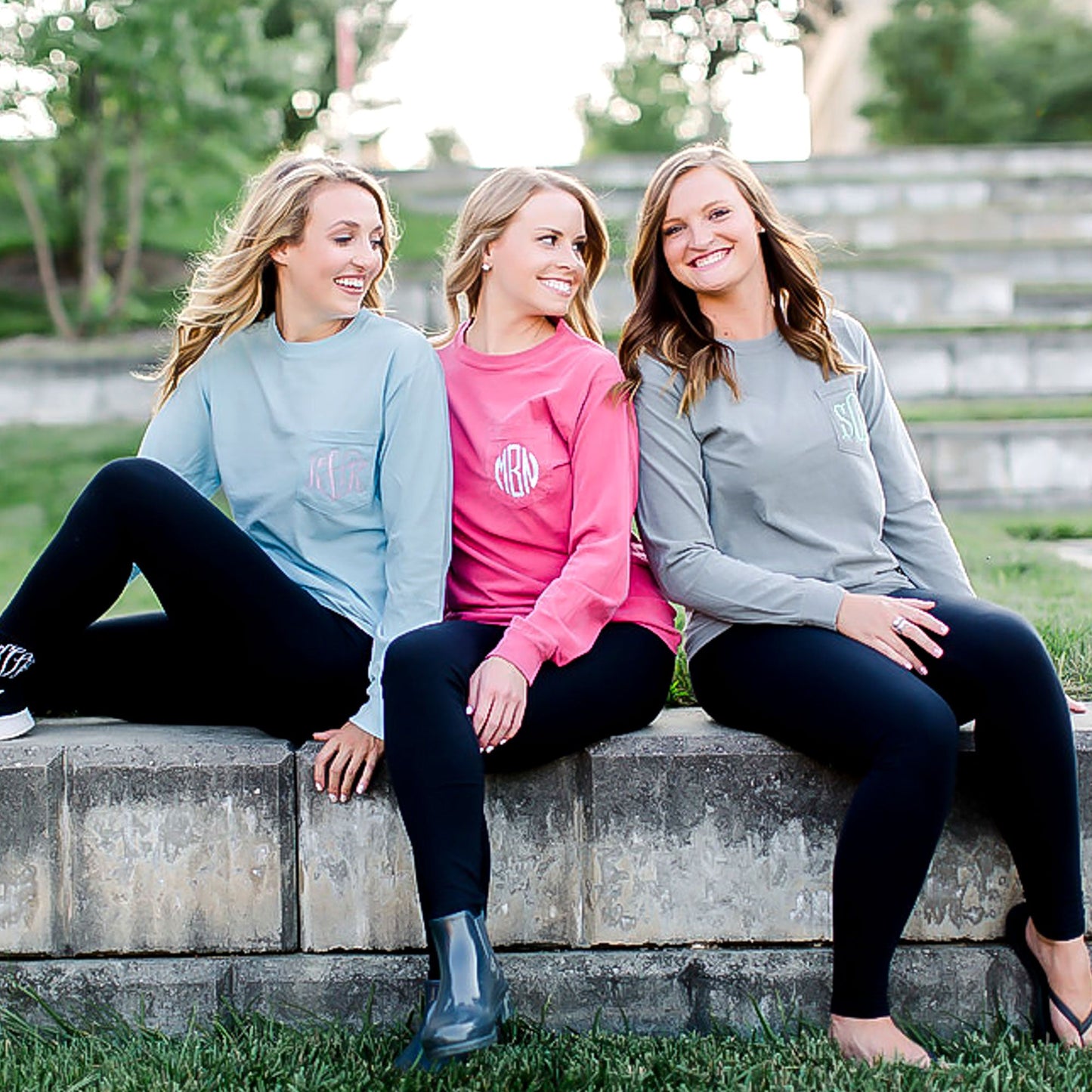 group of college students wearing custom embroidered long sleeve tops with pockets 